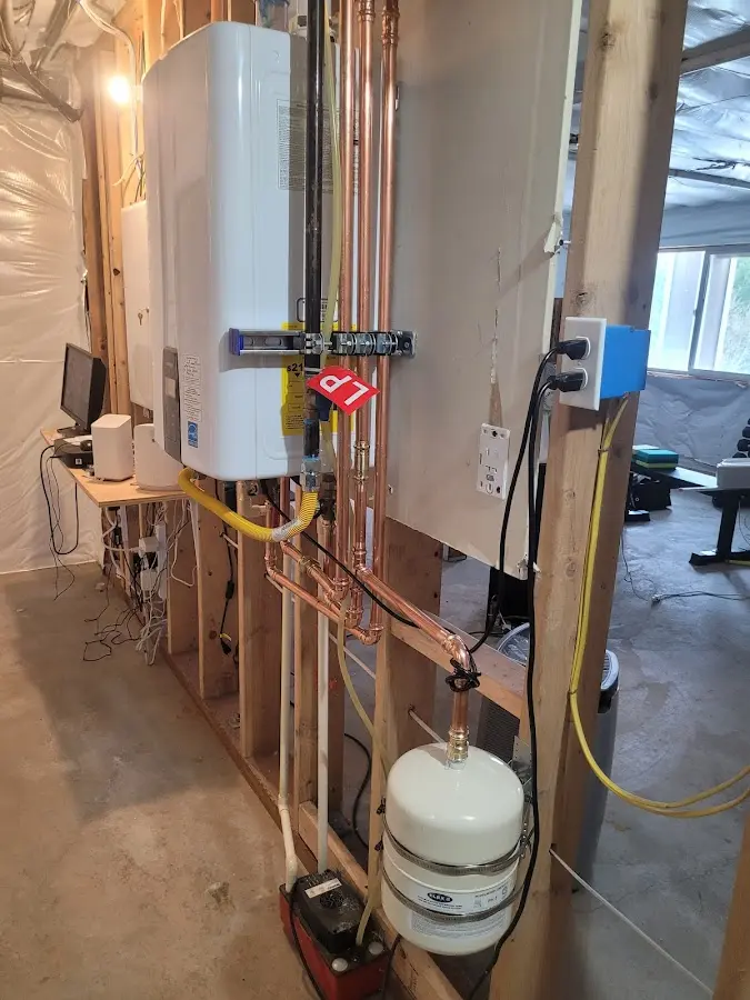 Licensed plumber repairing a kitchen sink in Westampton